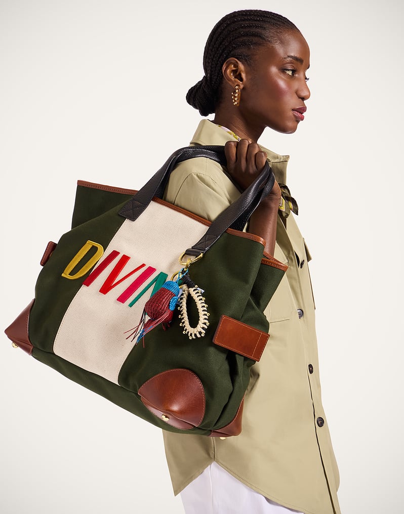 La DoubleJ Divine canvas tote with dark-green panels, leather details and colorful Divine embroidery